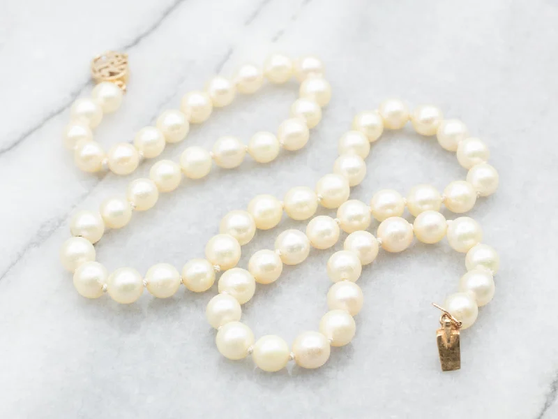 Ornate filigree necklaces-Saltwater Pearl Necklace with Gold Asian Character Clasp