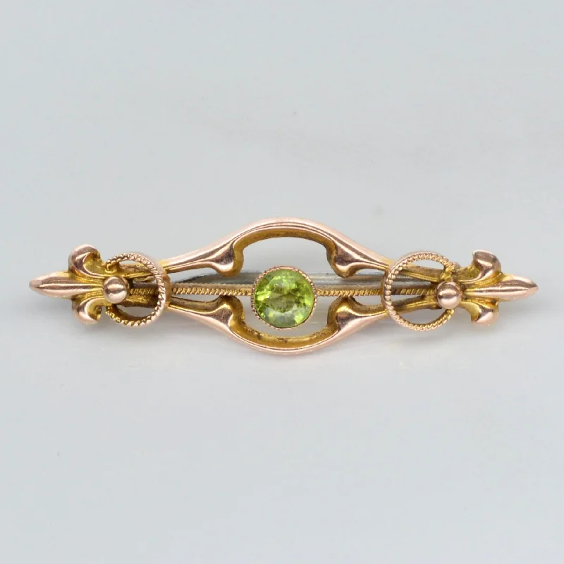 Carved wood brooches-10k Peridot Yellow Gold Brooch