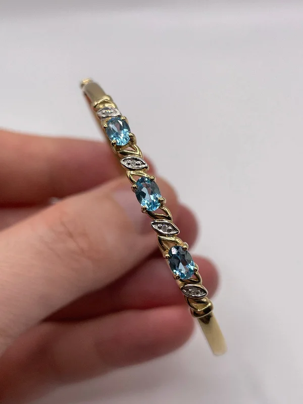 Glittering diamond bracelets-9ct gold topaz and diamond bangle